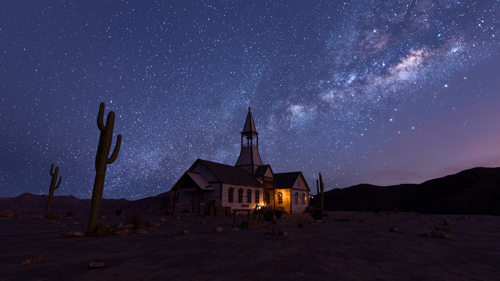 Desert church under a starry night sky.